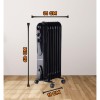 Calorifer electric cu ulei HAUSBERG HB-8905, 3 trepte, 600-900-1500 W, 7 elementi 110 mm x 580 mm, termostat reglabil, maner si rotite pentru o deplasare facila, indicator luminos functionare, negru